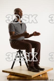 Sitting reference of whole body black white striped shirt brown…